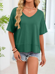Relaxed fit dark green v-neck t-shirt with short sleeves and a layered hem detail.