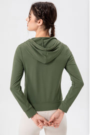 Matcha green performance fit hoodie with long sleeves and a drawstring hood.