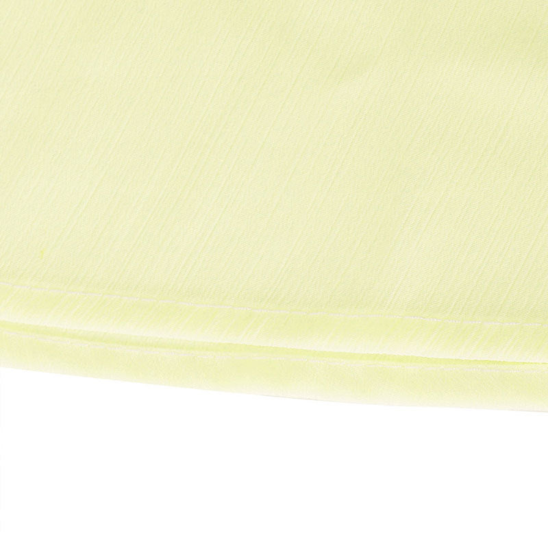 Light yellow airy cami and maxi skirt set fabric detail with subtle texture and double stitching.