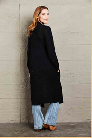 Black textured knit maxi cardigan with pockets, acrylic, long sleeve, open front.