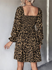 Smocked bodice leopard print mini dress with square neck and ruffled cuffs in olive brown.