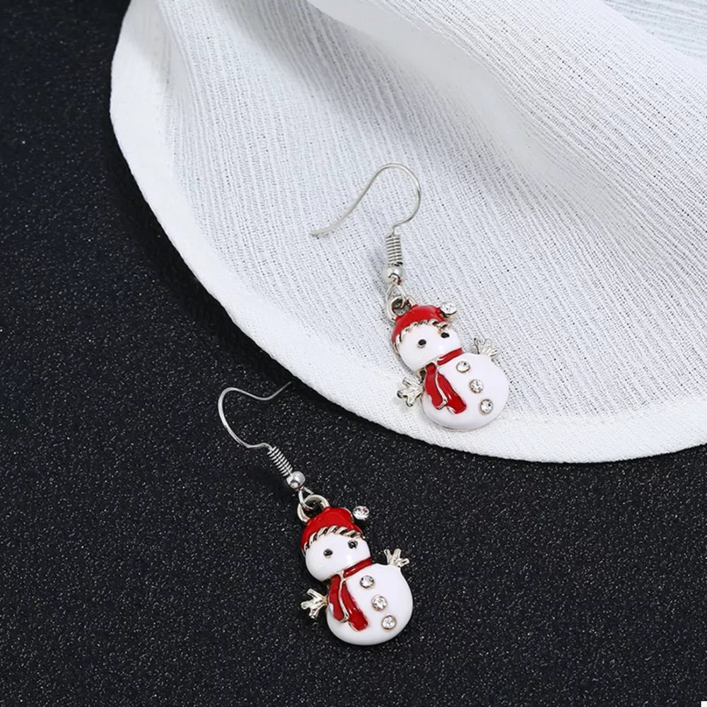 Festive snowman drop earrings with red scarf and hat, adorned with rhinestones.