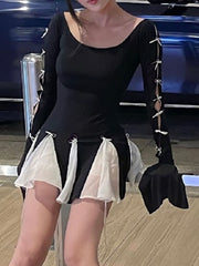 Black mini dress with bowknot details on sleeves and skirt, featuring sheer white accents.