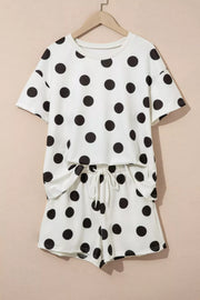 White polka dot loungewear set with crew neck top and drawstring shorts.