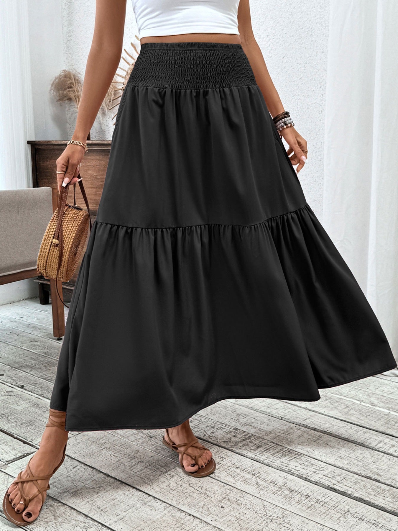 Black ruffled smocked waist maxi skirt with tiered hem