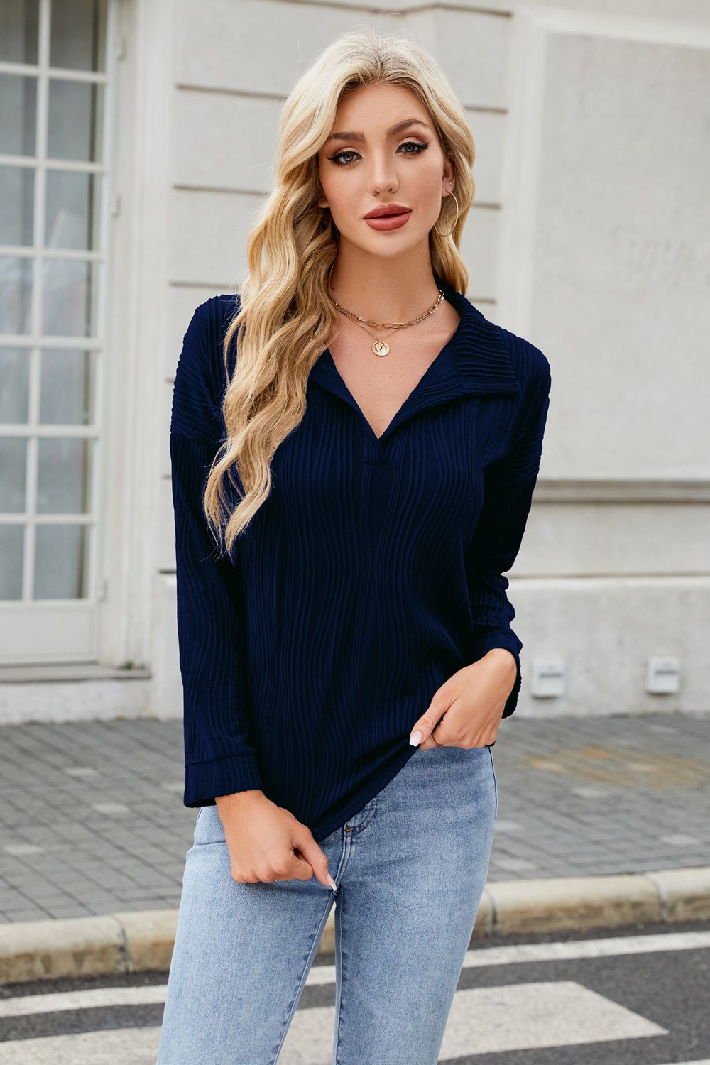 Dark Navy pleated wave-effect collared blouse with long sleeves.