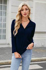 Dark Navy pleated wave-effect collared blouse with long sleeves.