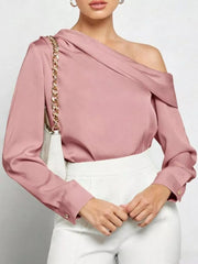 Elegant one-shoulder satin shirt in dusty rose with draped neckline and button cuffs.