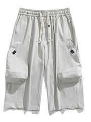 Light Gray cargo capris with adjustable drawstring and large side pockets.