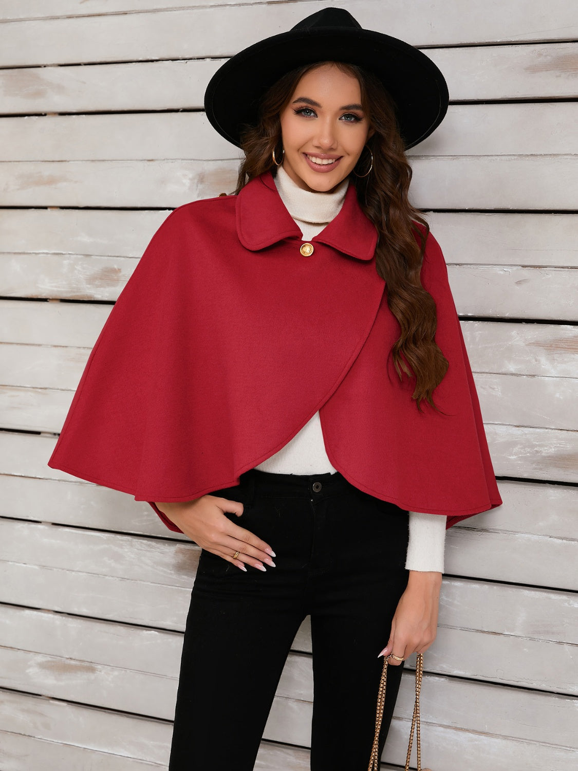 Deep Red asymmetric button-front cape jacket with a single gold button closure and spread collar.