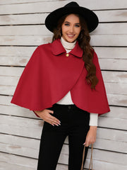 Deep Red asymmetric button-front cape jacket with a single gold button closure and spread collar.