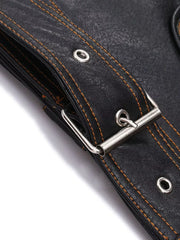Black faux leather motorcycle coat detail with orange stitching and brass hardware buckle.