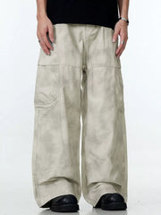 Relaxed fit beige cargo pants with a tie-dye effect and multiple pockets.