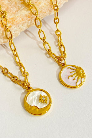 Celestial charm necklaces in gold-plated metal with sun and moon pendants.
