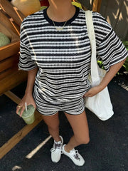 Striped relaxed fit two-piece set in black and white with short sleeves and shorts.