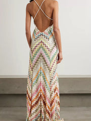 Chevron knit backless maxi dress with crisscross straps and colorful zigzag pattern.
