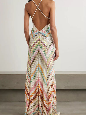 Chevron knit backless maxi dress with crisscross straps and colorful zigzag pattern.