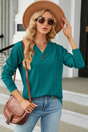 Turquoise textured cable-knit henley pullover with button detail and v-neck