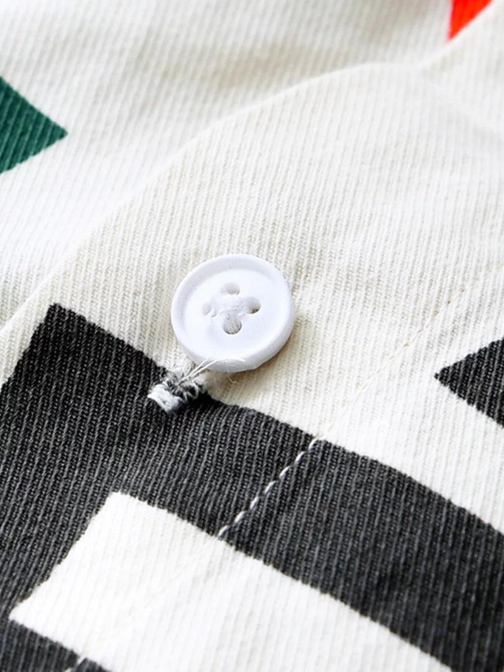 Men's long john shirt in white cotton with bold black letter print and button detail.