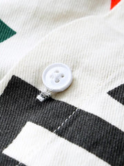 Men's long john shirt in white cotton with bold black letter print and button detail.