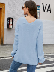 Misty Blue ribbed knit sweater with V-neck and subtle sleeve detail.