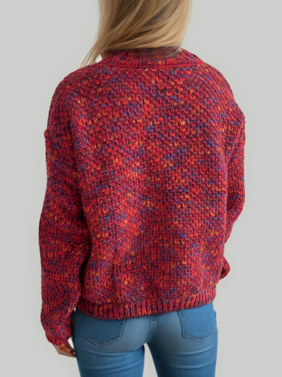 Textured mélange mock neck pullover in Deep Red with speckles of blue and yellow.