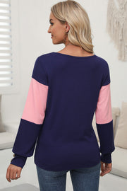 Navy and blush pink contrast panel sweater with button cuff detail