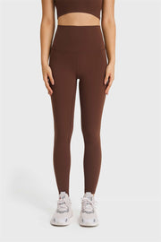 Brown high rise leggings with a seamless waistband and full length legs.