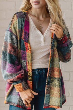 Patchwork plaid oversized fleece jacket in multicolored with button front and pockets.