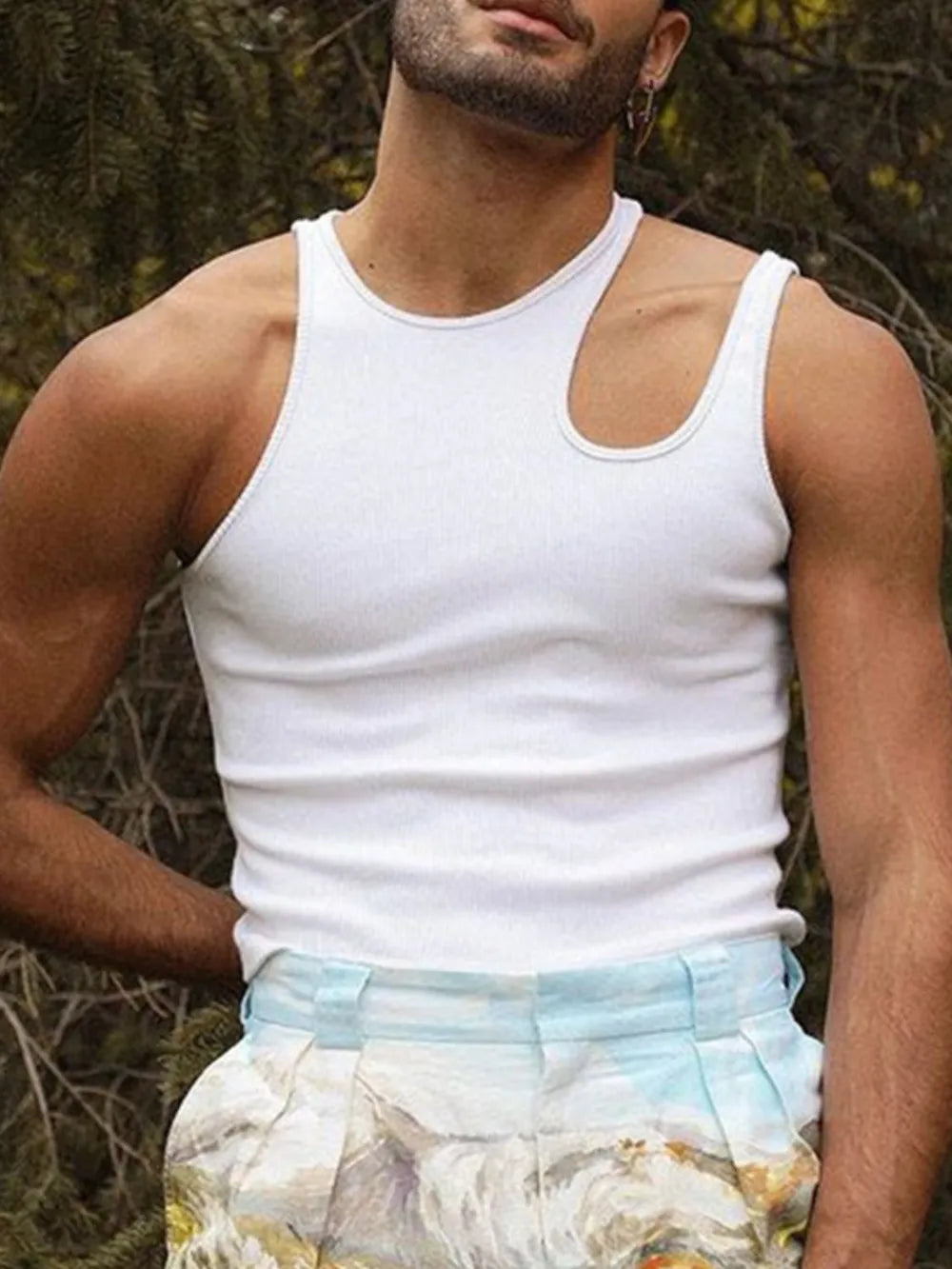 White ribbed tank top with asymmetrical neckline and sculpted shoulder detail
