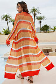 Open-knit striped maxi cardigan in orange and white cotton, featuring a relaxed fit and open front.