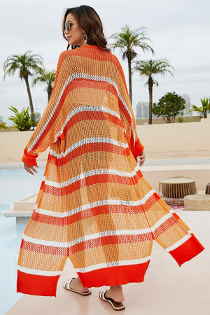 Open-knit striped maxi cardigan in orange and white cotton, featuring a relaxed fit and open front.