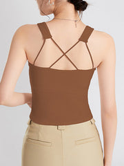 Caramel crop tank with crisscross spaghetti straps and wide shoulder straps.
