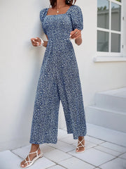 Smocked bodice floral jumpsuit with puff sleeves and wide legs in Royal Blue.