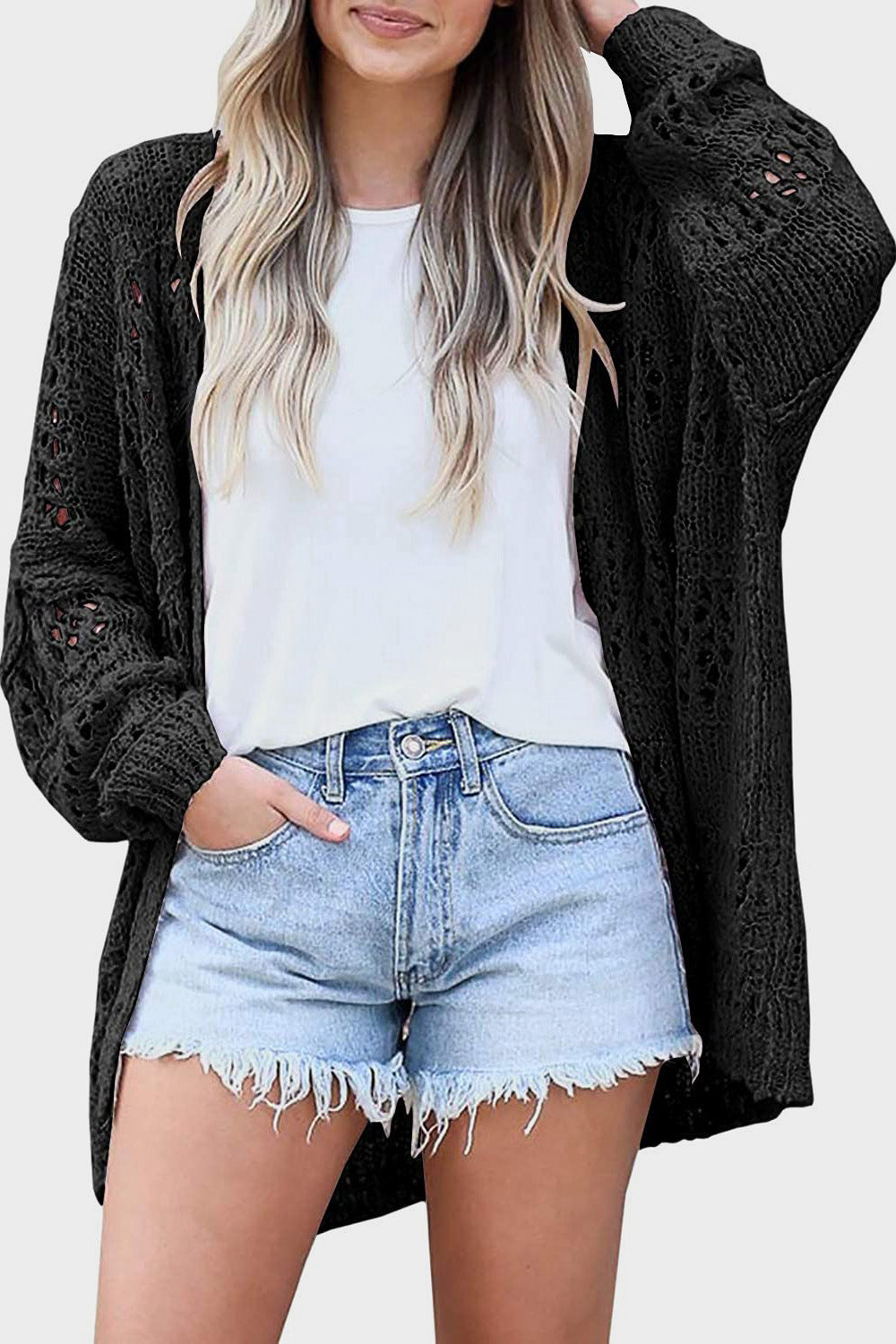 Black open-knit slouchy cardigan with long sleeves and a relaxed fit.