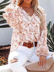 Floral print v-neck long sleeve maternity shirt with bishop sleeves.