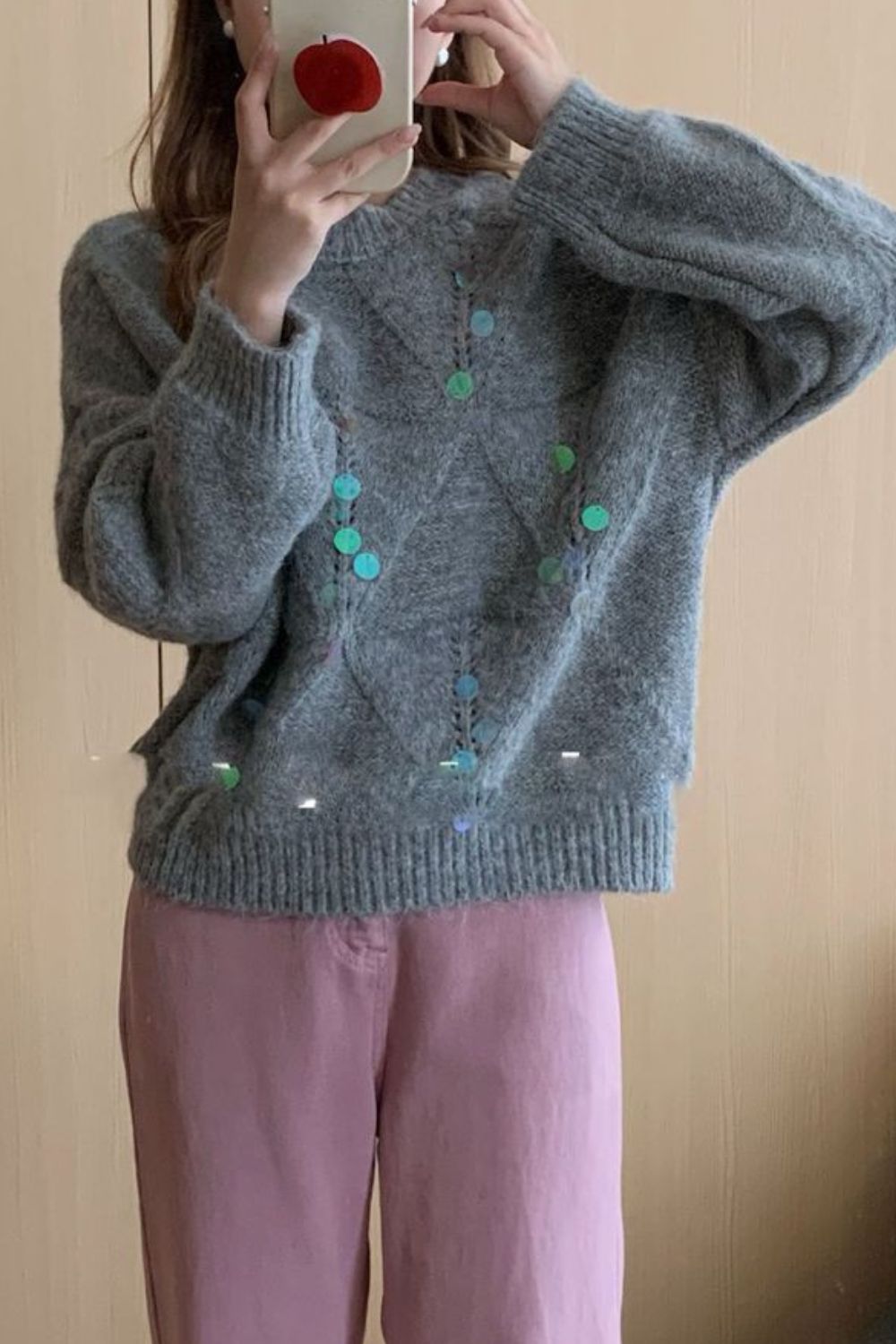Gray diamond knit sweater with colorful sequin embellishments and crew neck.