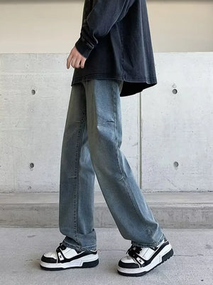 Men's light wash vintage wide-leg jeans with a relaxed fit.