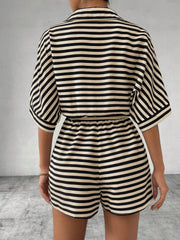 Black and tan striped romper with short sleeves and elastic waist shorts.