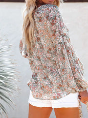 Maternity floral print long sleeve shirt in green with V-neck, shown from the back.
