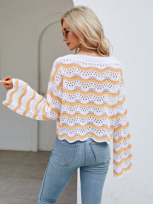 Scalloped crochet crop sweater with orange-red and white wavy stripes, bell sleeves.
