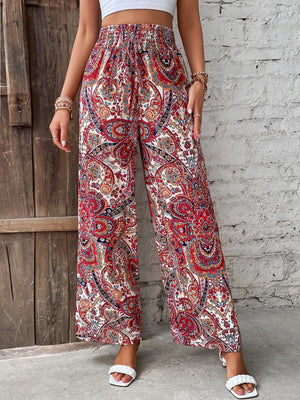 Paisley palazzo trousers in multicolor with a drawstring waist and wide legs.