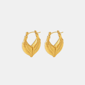 Textured gold leaf hoop earrings with a subtle sheen.