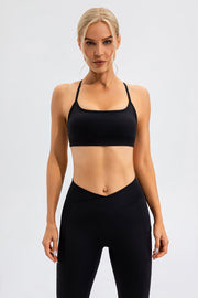 Black sports bra with thin crisscross back straps and square neckline