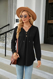 Black textured henley hooded tunic with button detail and drawstring hem