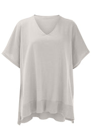 Light Gray V-neck knit poncho top with short sleeves and ribbed hem detail.
