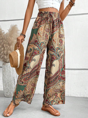 Paisley palazzo trousers with drawstring waist in multicolor, featuring a wide leg and boho print.