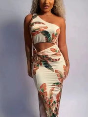 Tropical cutout maxi dress with one shoulder, side slit, and leaf print.