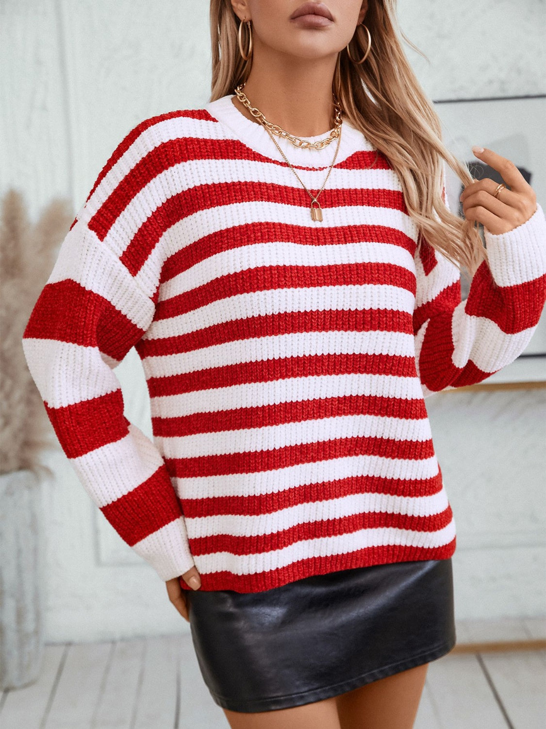 Bold stripe crewneck sweater in red and white knit with a casual fit.