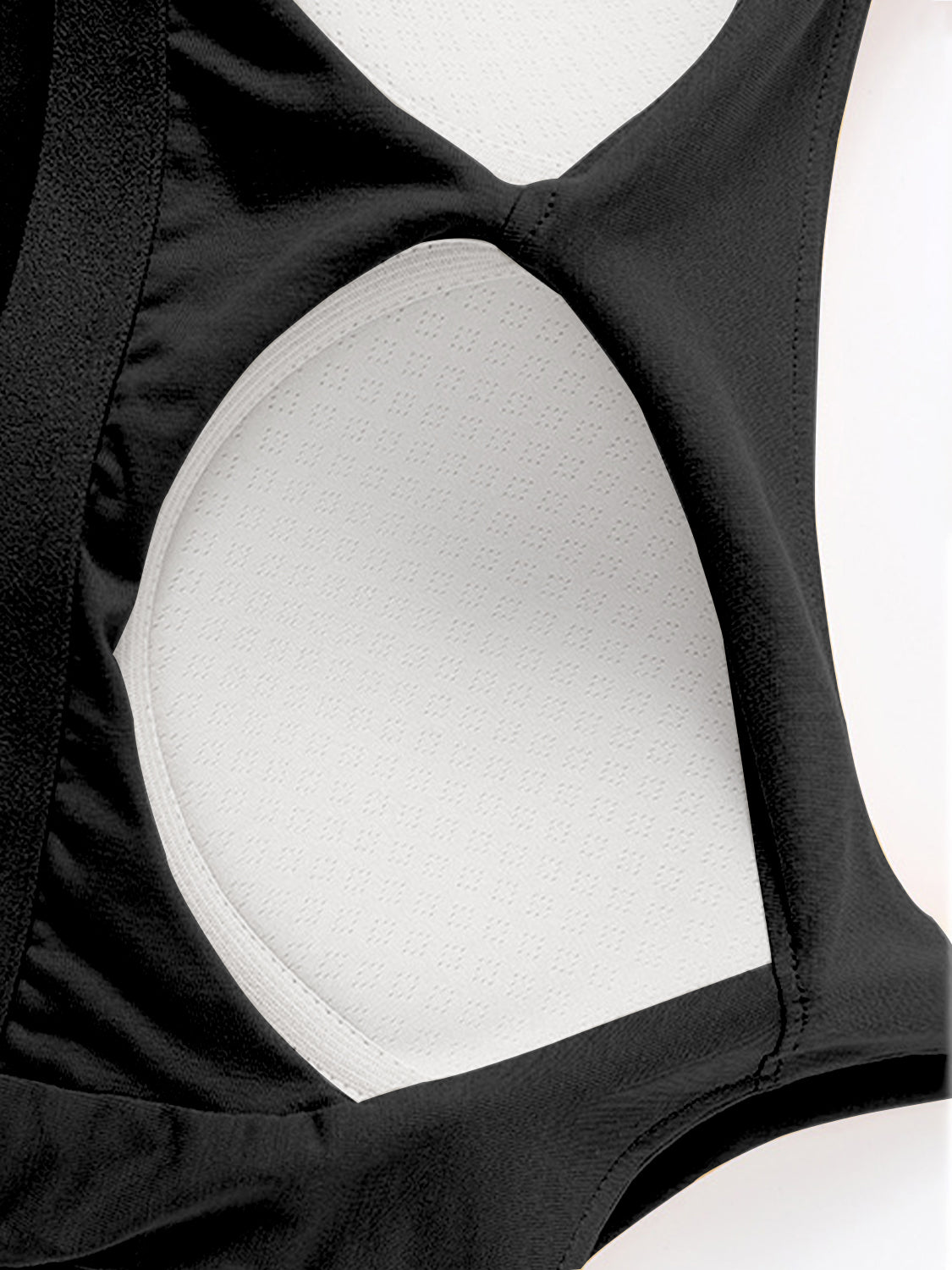 Black built-in bustier crop camisole with white textured lining and elastic trim.
